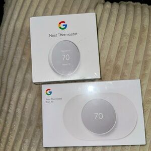 Google Nest Snow Home energy saving Thermostat with Trim kit both new in box.